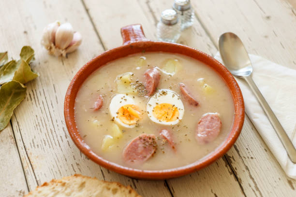 istock Traditional polish soup called Zurek served with bread 928869512