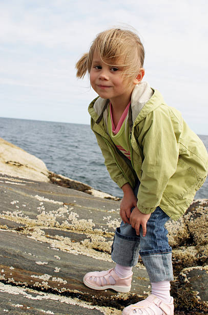 istock Little girl on the cliff 92887005