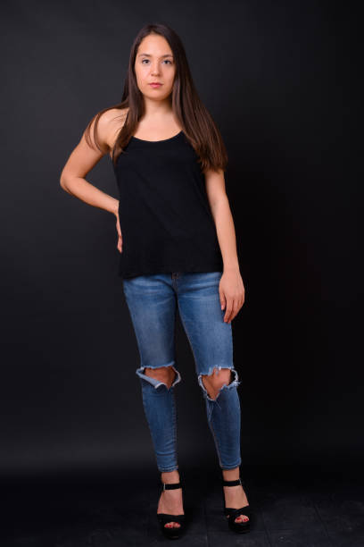 istock Young beautiful multi-ethnic woman against black background 928870610