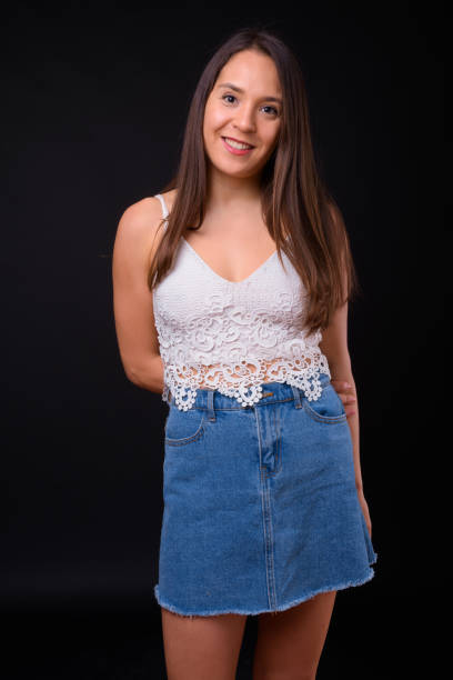 istock Young beautiful multi-ethnic woman against black background 928873576