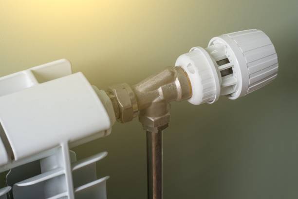 istock Heating Radiator, White radiator in an apartment. 928874110
