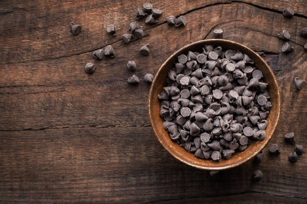 Chocolate chips or morsels in a bowl stock photo