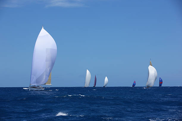 Sailboats sailing in the blue sea stock photo