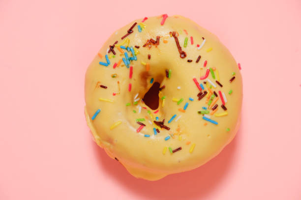 istock Delicious donut on pink background 928882606