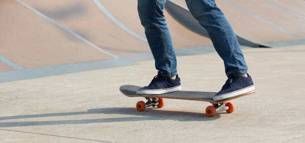 istock skateboarder legs skateboarding on skatepark 928886902