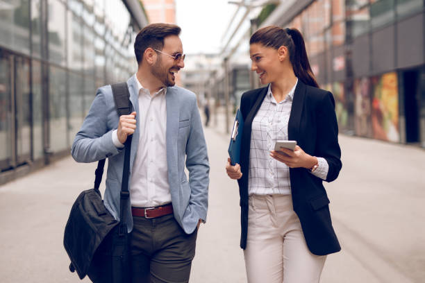 istock Two business people on their way to work 928889324
