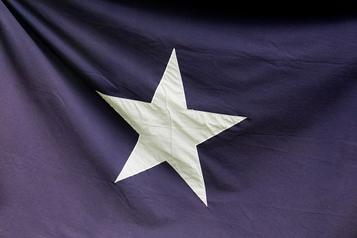 This flag, with a single white star on a dark blue background, was one of the first flags used by the South in the American Civil war.  It was raised over the capitol building in Mississippi in January of 1861 when that state seceded from the Union.