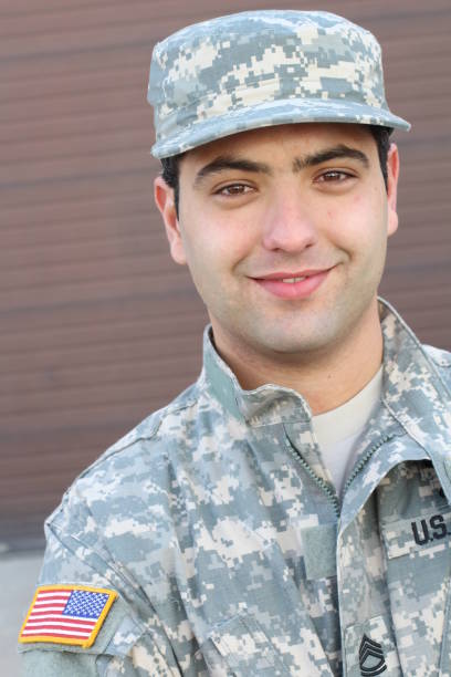 istock Soldier smiling close up isolated 928890196