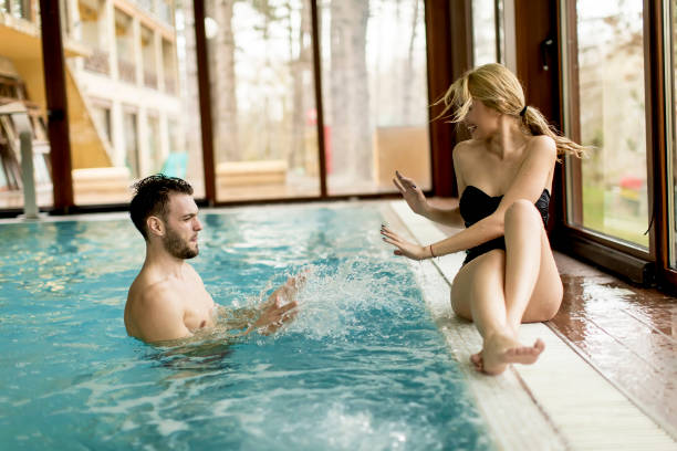 istock Loving couple relaxing in the spa by the pool 928890434