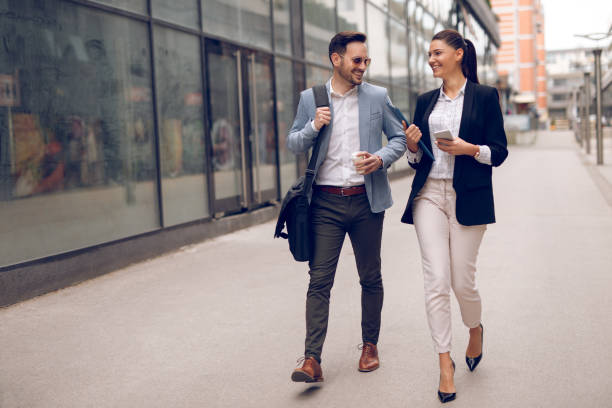 istock Two business people on their way to work 928891232