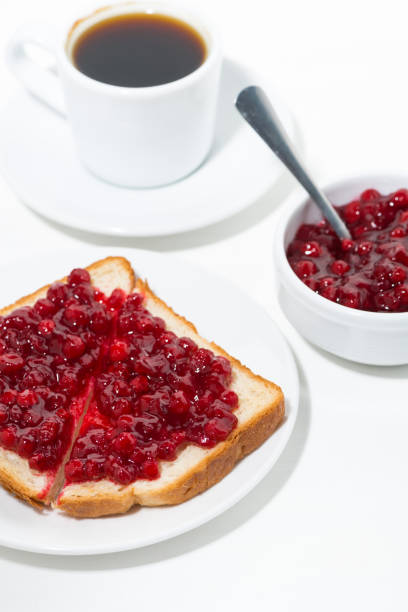 toast with cranberry jam for sweet breakfast, vertical