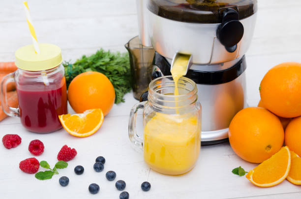 istock Preparing juice from fresh fruits and vegetables 928895380