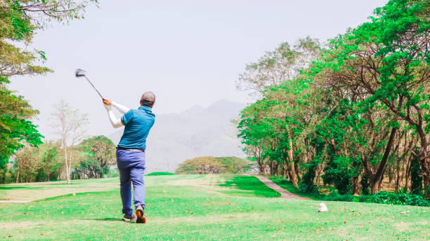 istock Golf ball on tee ready to be shot at beautifull golf course . 928895754