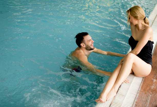 istock Loving couple relaxing in the spa by the pool 928895790