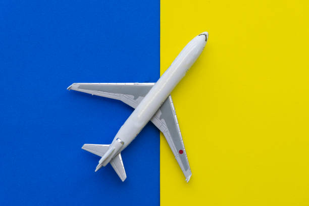 Miniature airplane travel theme. yellow background with copy space.