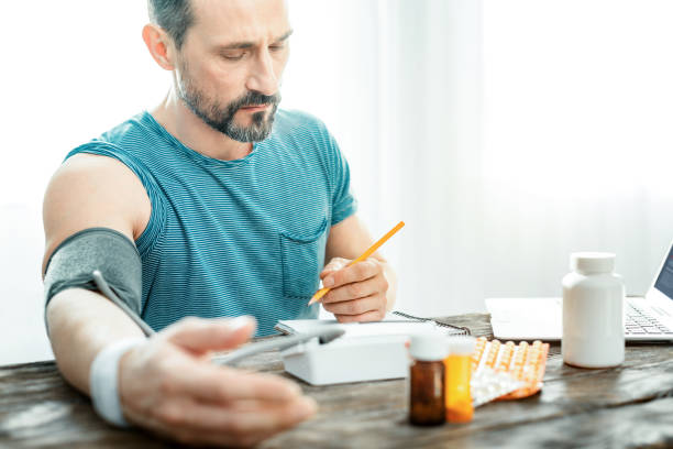 istock Embarrassing confused man sitting and looking at his notebook 928902114