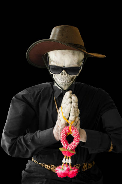 istock Isolated and clipping path of skeleton praying in black background. 928902214