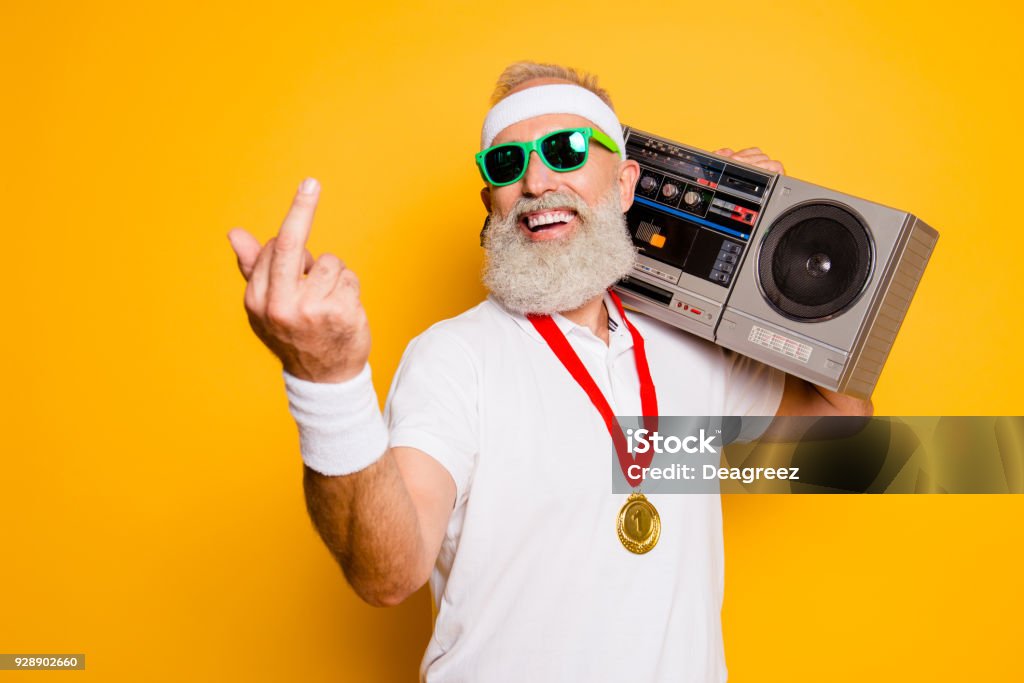 Fuck it! Crazy aged rude sporty funny sexy athlete grandpa in eyewear with recorder. Old school, swag, fooling around, gym, workout, technology, groove, stereo sound, funky leisure, chill, young Medal Stock Photo