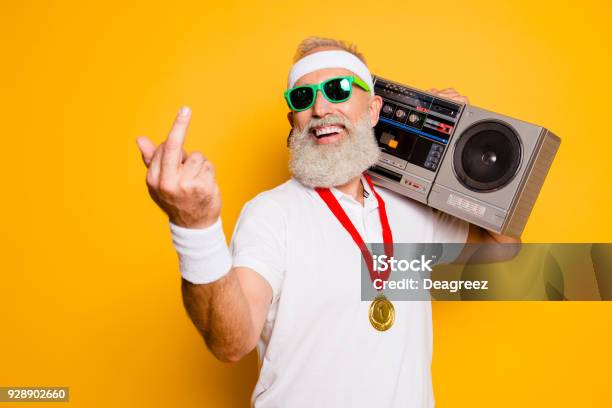 Fuck It Crazy Aged Rude Sporty Funny Sexy Athlete Grandpa In Eyewear With Recorder Old School Swag Fooling Around Gym Workout Technology Groove Stereo Sound Funky Leisure Chill Young Stock Photo - Download Image Now