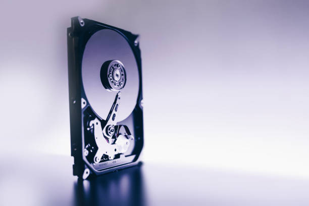istock Disassembled hard drive from the computer, hdd with mirror effect. Opened hard drive from the computer hdd with mirror effects. Part of computer pc, laptop 928902784