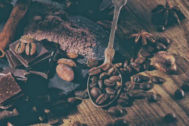 istock Broken dark chocolate, cocoa powder and coffee beans 928902846