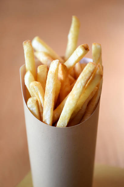 istock Portion of potato chips served in a container 928902858