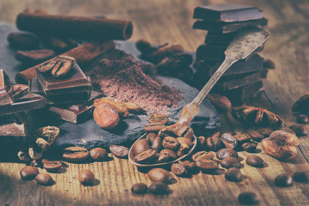 istock Broken dark chocolate, cocoa powder and coffee beans 928902918