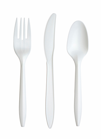 A set of plastic silverware, isolated on white.