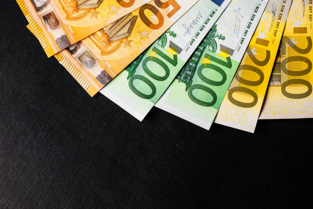 istock Euro banknotes close up. Several hundred euro banknotes 928905300