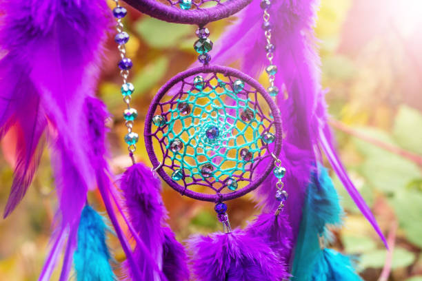 istock Handmade dream catcher with feathers threads and beads rope hanging 928905644
