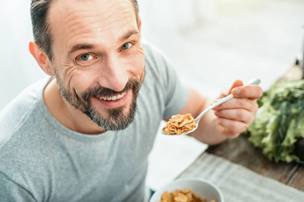istock Joyful pleasant man looking up and smiling 928905908