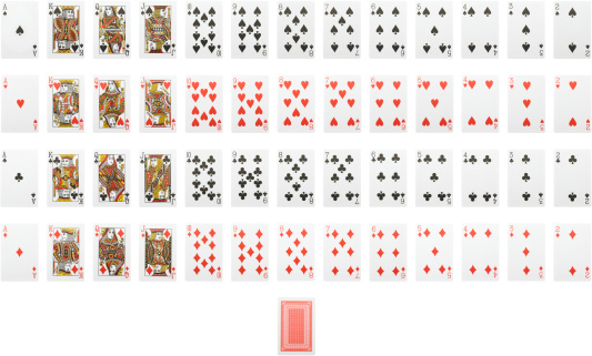 Casino games background isolated on black table with playing cards, betting chips, dice and roulette for playing various games of chance. Front view.
