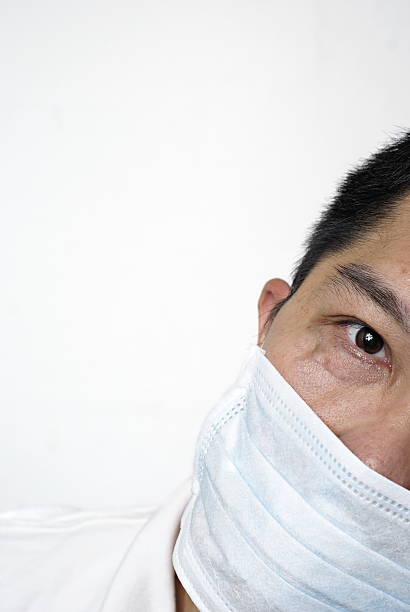 istock Man in medical mask partially hidden 92890846