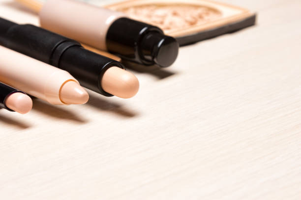 Make-up products to hide skin imperfections. Different concealers. Side view, copy space