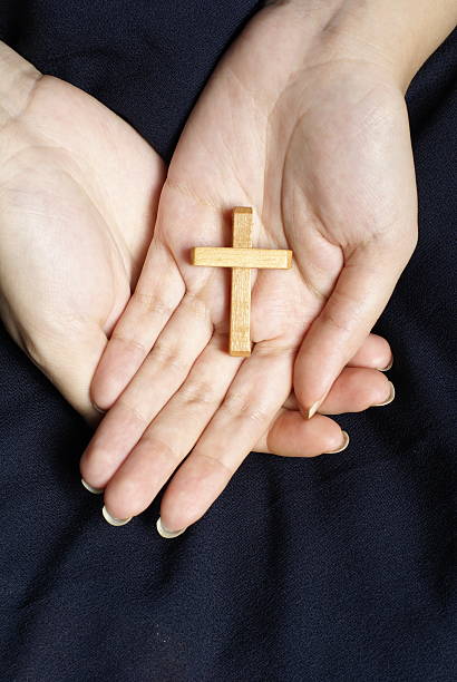 istock Female hands holding crucifix 92890898