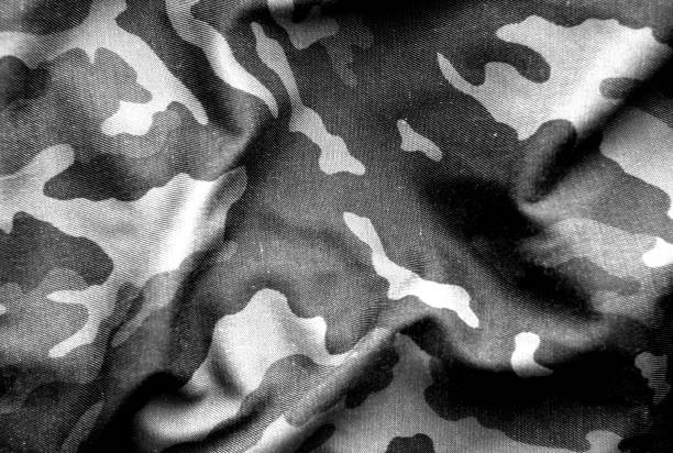 Military uniform pattern with blur effect in black and white. Military uniform pattern with blur effect in black and white. Abstract background and texture. camouflage clothing photos stock pictures, royalty-free photos & images