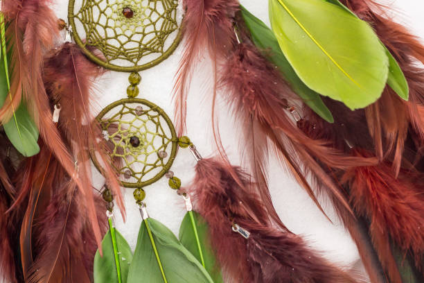 istock Handmade dream catcher with feathers threads and beads rope hanging 928917138