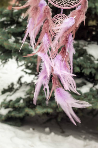 istock Handmade dream catcher with feathers threads and beads rope hanging 928917418
