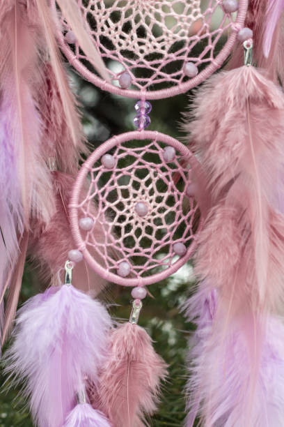 istock Handmade dream catcher with feathers threads and beads rope hanging 928917432
