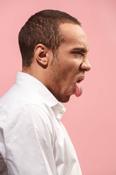 istock Young man with disgusted expression repulsing something, isolated on the pink 928917774