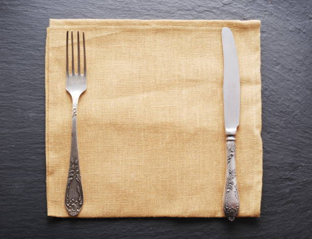 istock Silver cutlery on a dark grey background. 928922904