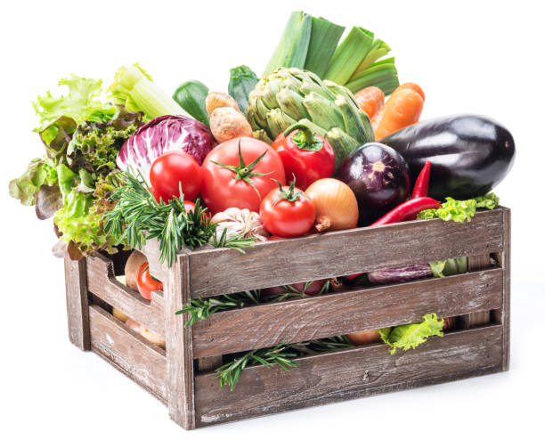 istock Fresh multi-colored vegetables in wooden crate. 928925412