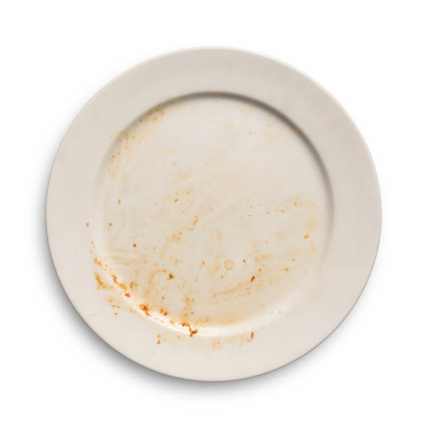 Top view of empty plate, dirty after the meal is finished isolate. stock photo