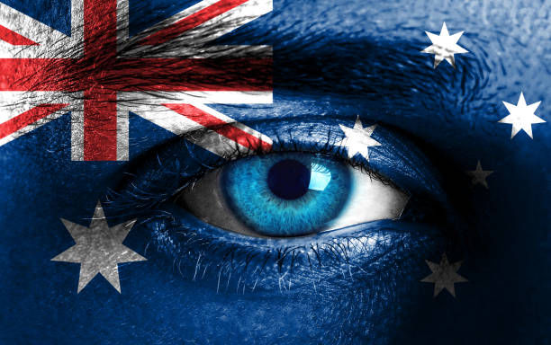 istock Human face painted with flag of Australia 928926432