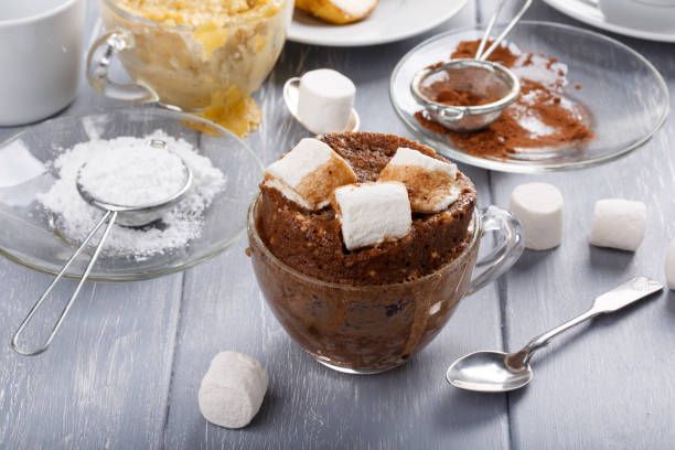 istock Quick chocolate cake with marshmallow in a glass mug from microwave 928930252