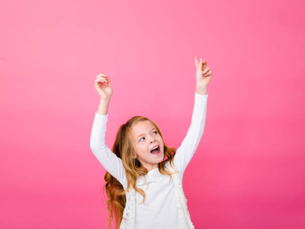 istock Cheerful Girl Against Pink Background 928930456