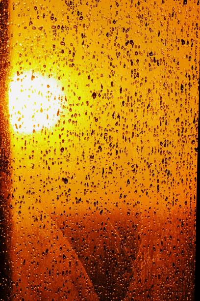 istock Full Frame Shot Of Wet Glass During Sunset 928932064