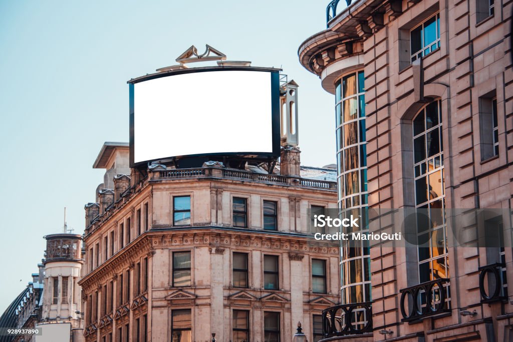 Advertisement panel on top of building A blank advertisement panel on top of a building Billboard Stock Photo