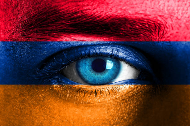 istock Human face painted with flag of Armenia 928946926