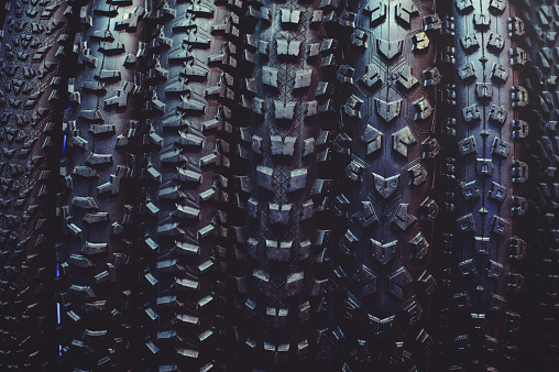 The tires on the bicycle wheel are in a row. selling a piece of mountain bike tires in closeup.